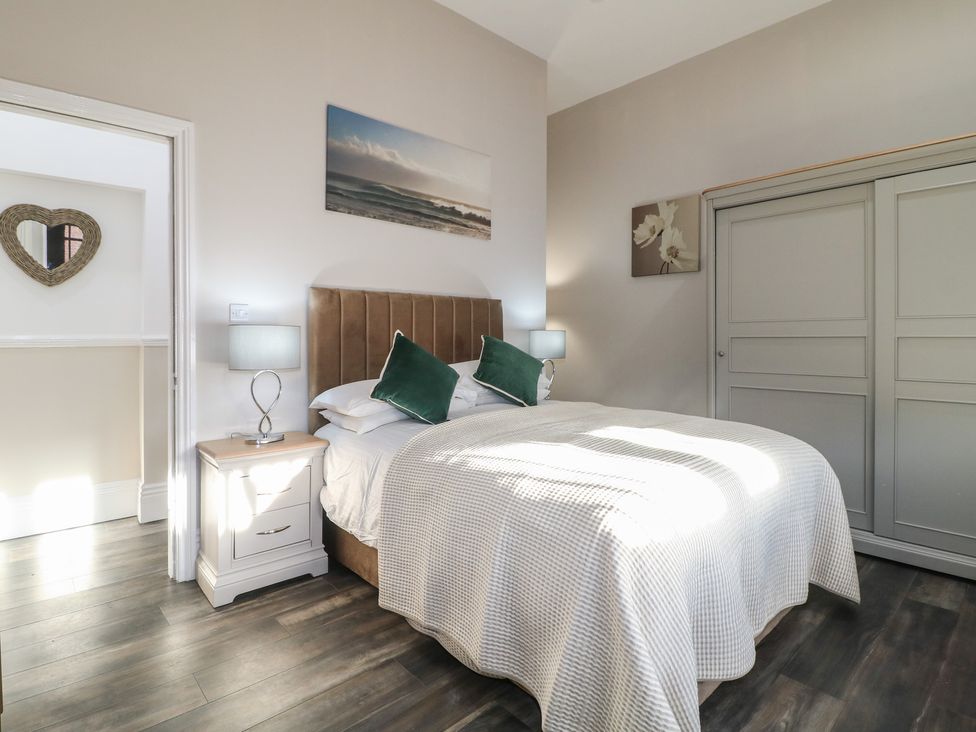 A bedroom with a bed and nightstand at Unit 6 Apt 3 in Sheffield