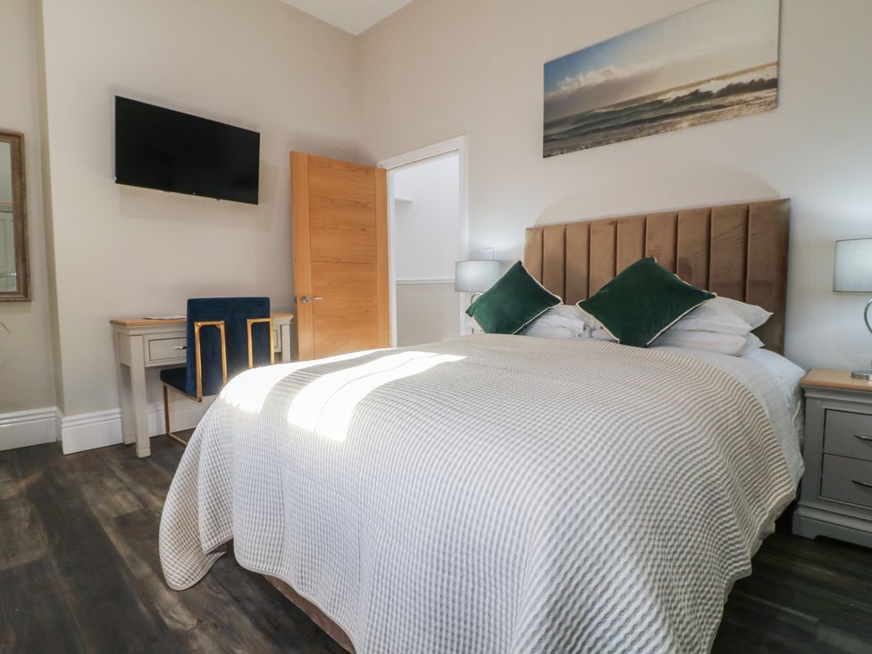 A bedroom with a bed and television at Unit 6 Apt 3 Sheffield