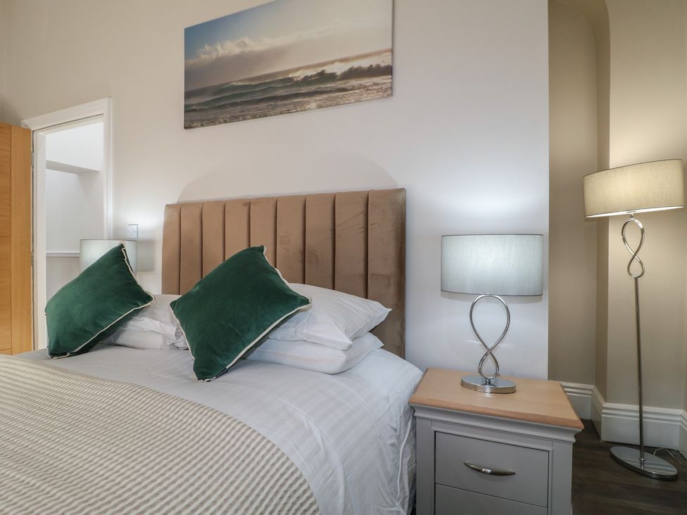 A bedroom with a bed and bedside table at Unit 6 Apt 3 in Sheffield