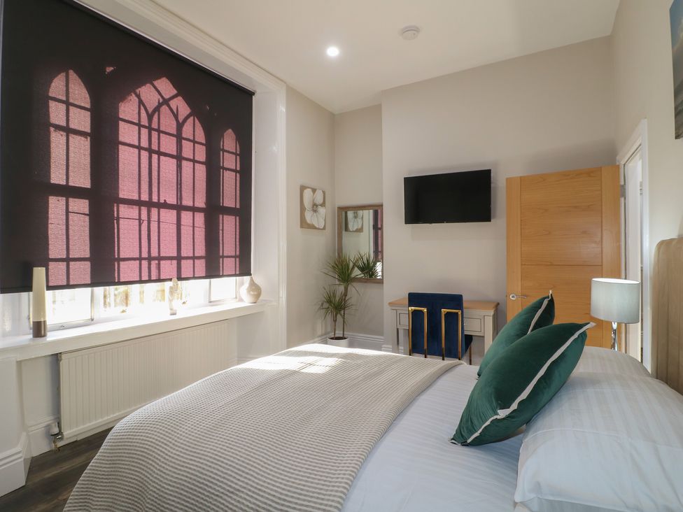 A bedroom with a bed and a television at Unit 6 Apt 3 in Sheffield