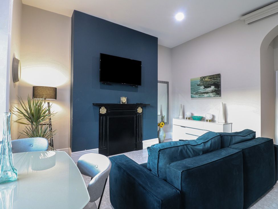 A living room with a television and sofa at Unit 6 Apt 1 Sheffield