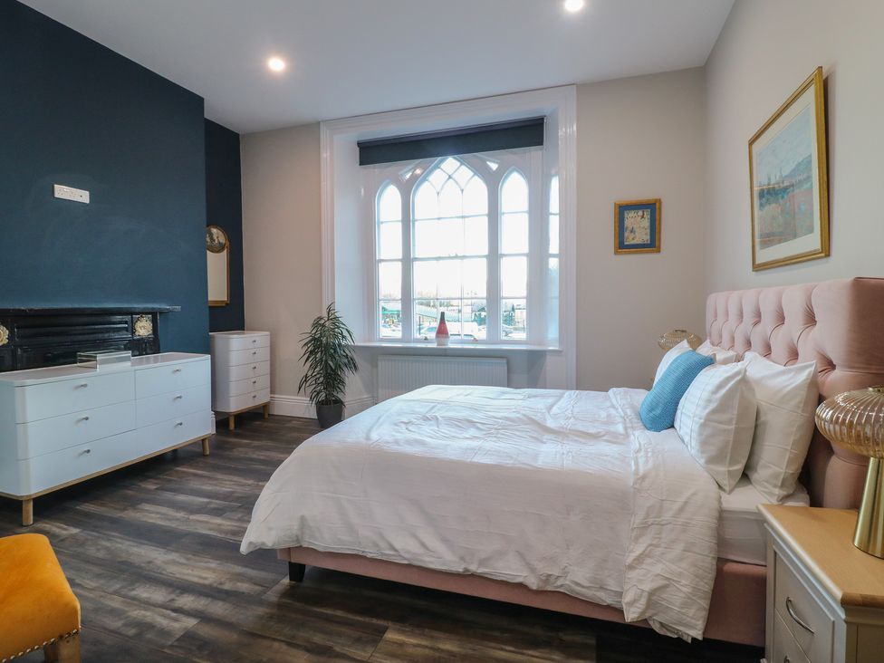 A bedroom with a bed and a dresser at Unit 6 Apt 1 in Sheffield