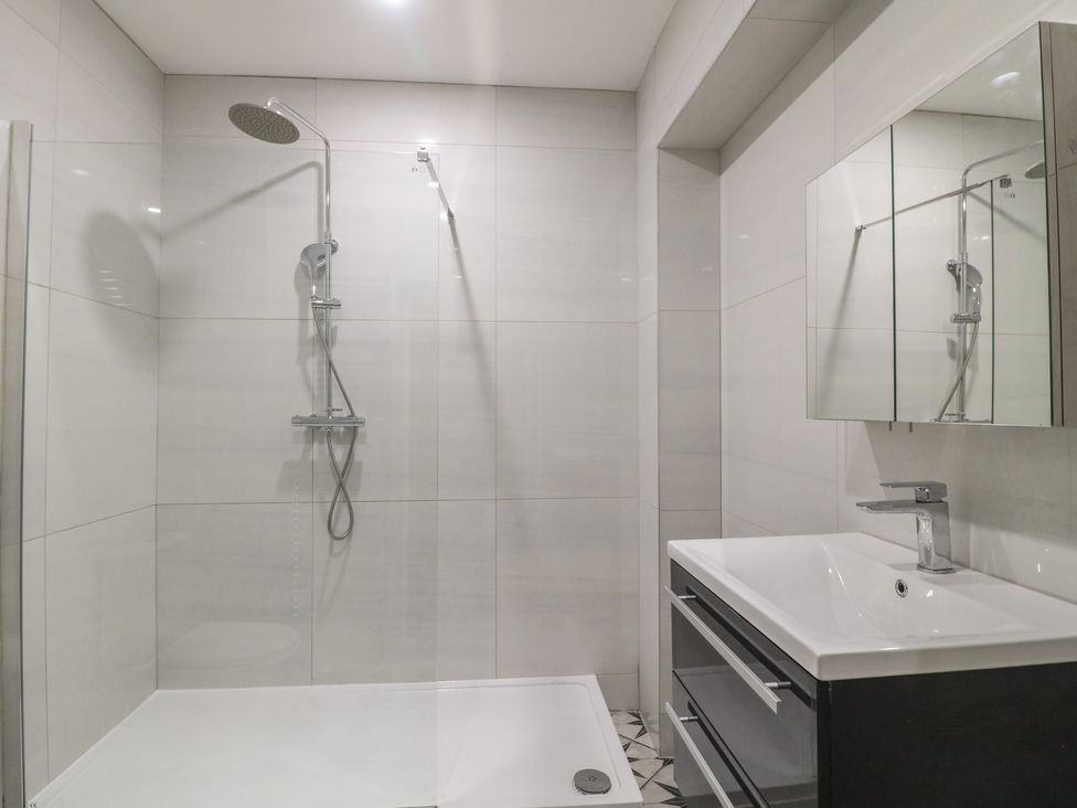 A bathroom with a shower and sink at Unit 6 Apt 1 in Sheffield