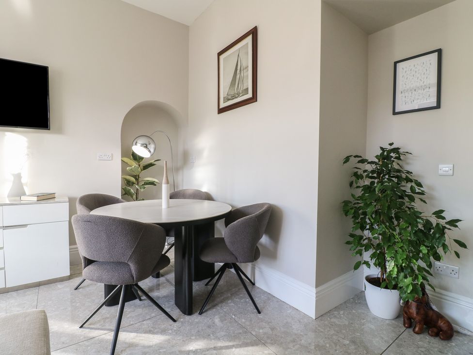 A dining room with a table and chairs at Unit 7 Apt 2 Sheffield