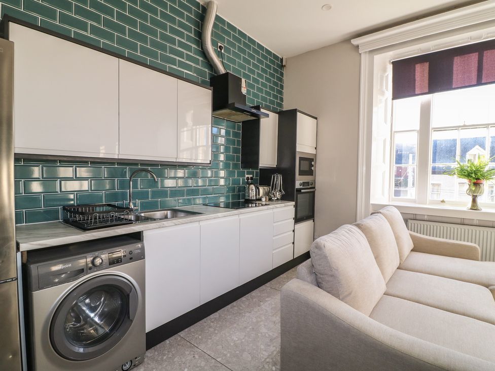 A kitchen with a sofa and appliances at Unit 7 Apt 2 in Sheffield