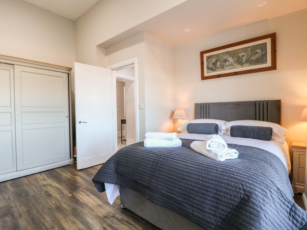 A bedroom with a bed and wardrobe at Unit 7 Apt 2 in Sheffield