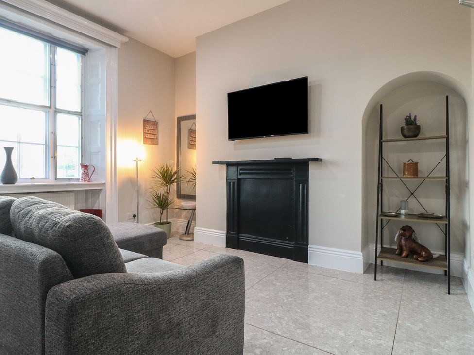 A living room with a sofa and a television at Unit 7 Apt 3 in Sheffield