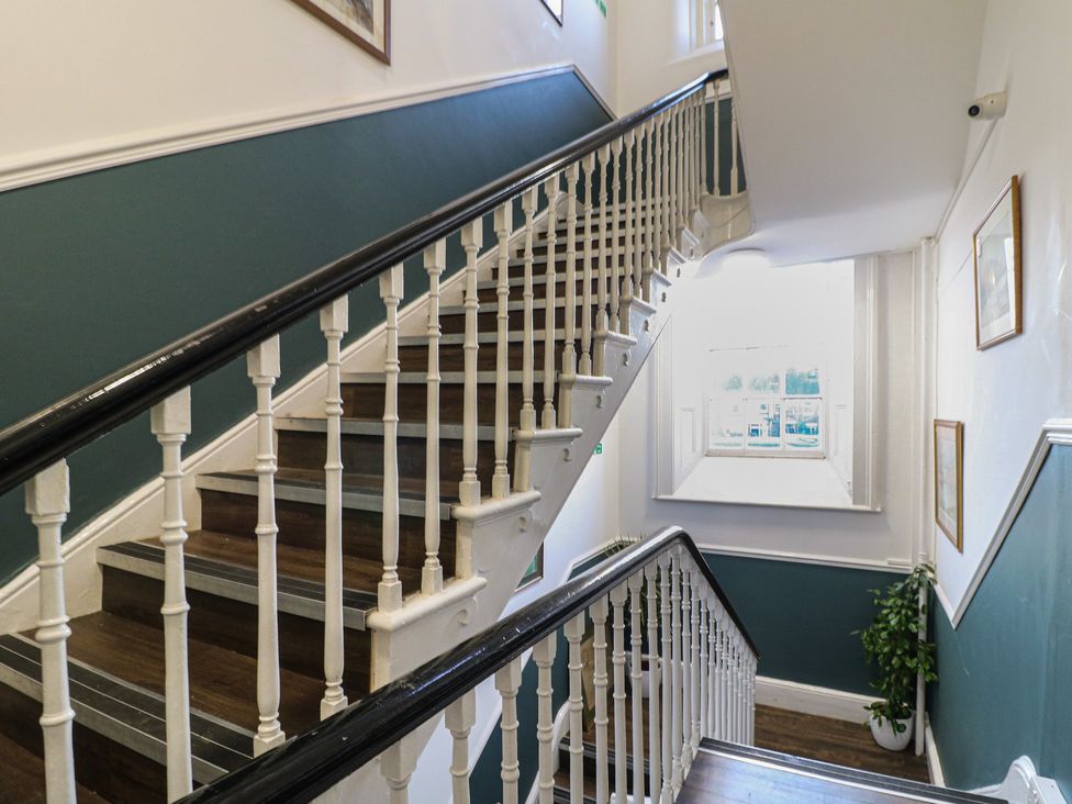 A staircase with a railing and a window at Unit 7 Apt 3 Sheffield