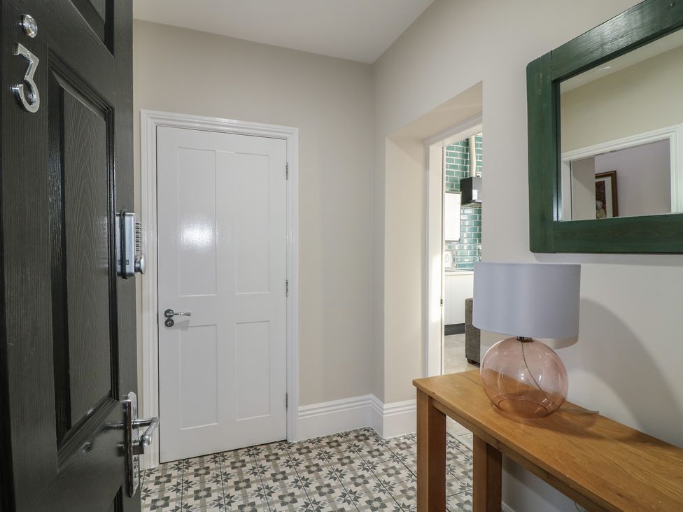 A hallway with a table and lamp at Unit 7 Apt 3 in Sheffield