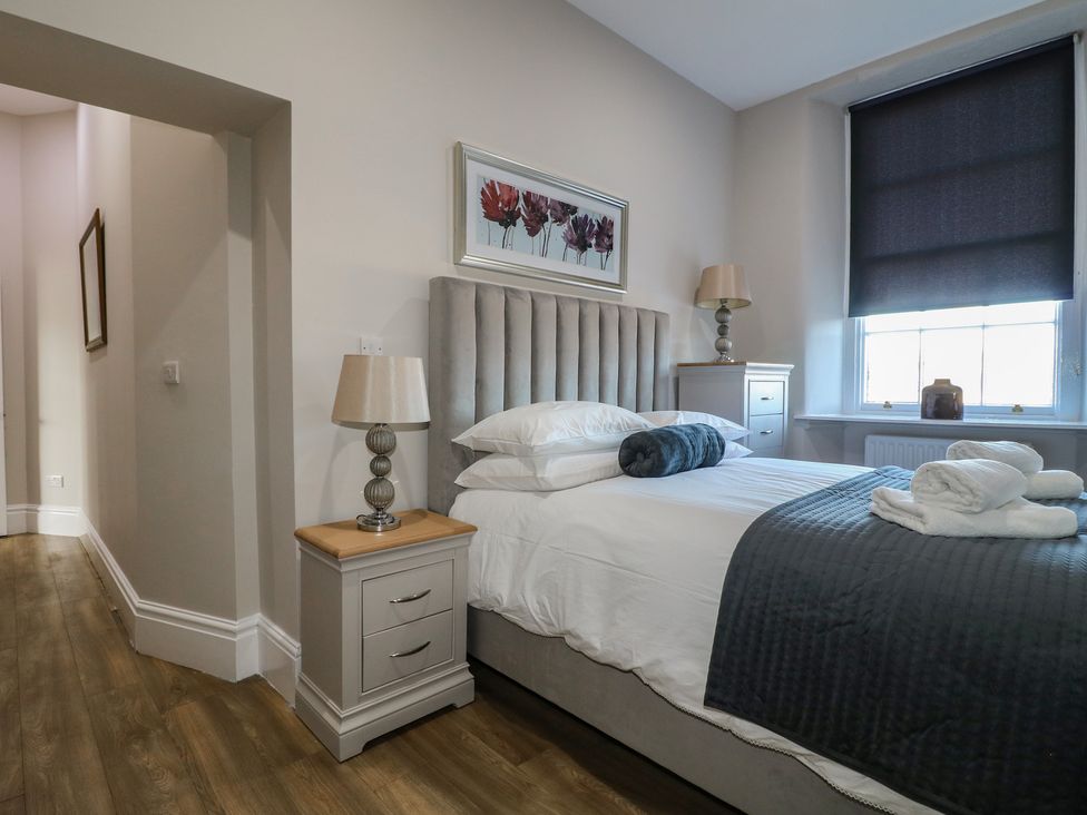 A bedroom with a bed and nightstand at Unit 7 Apt 3, Sheffield