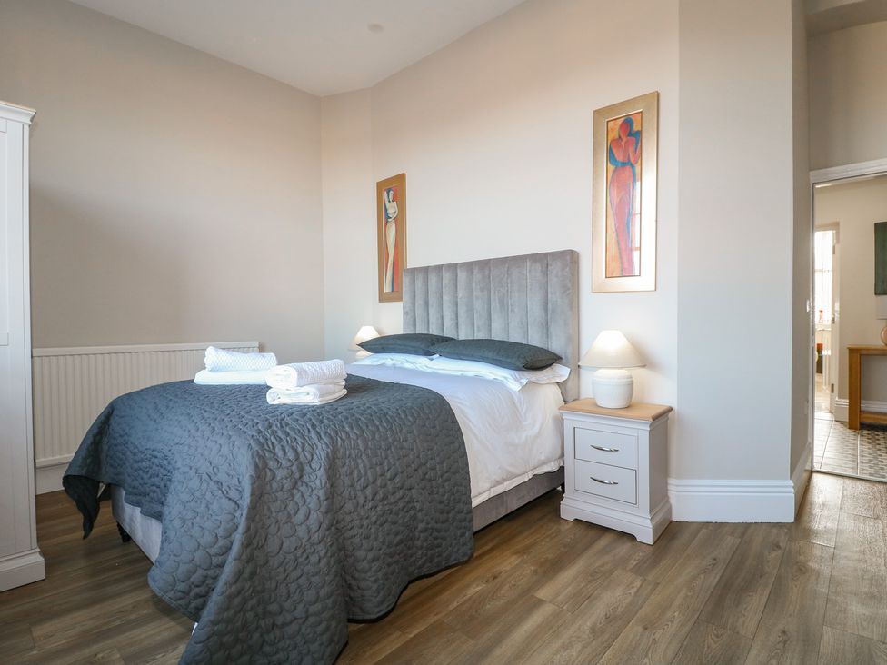 A bedroom with a bed and art on the wall at Unit 7 Apt 3 Sheffield