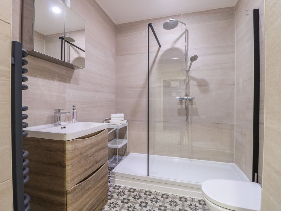 A bathroom with a shower, sink, and toilet at Unit 7 Apt 3 in Sheffield