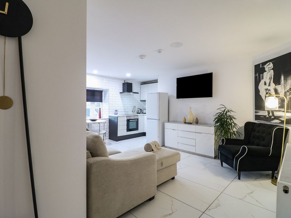 A living room with a sofa and television at Unit 7 Apt 4 in Sheffield