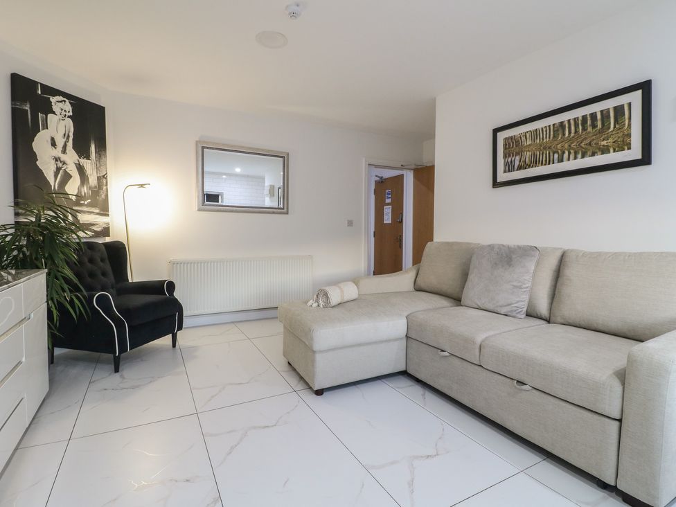 A living room with a sofa and armchair at Unit 7 Apt 4 in Sheffield