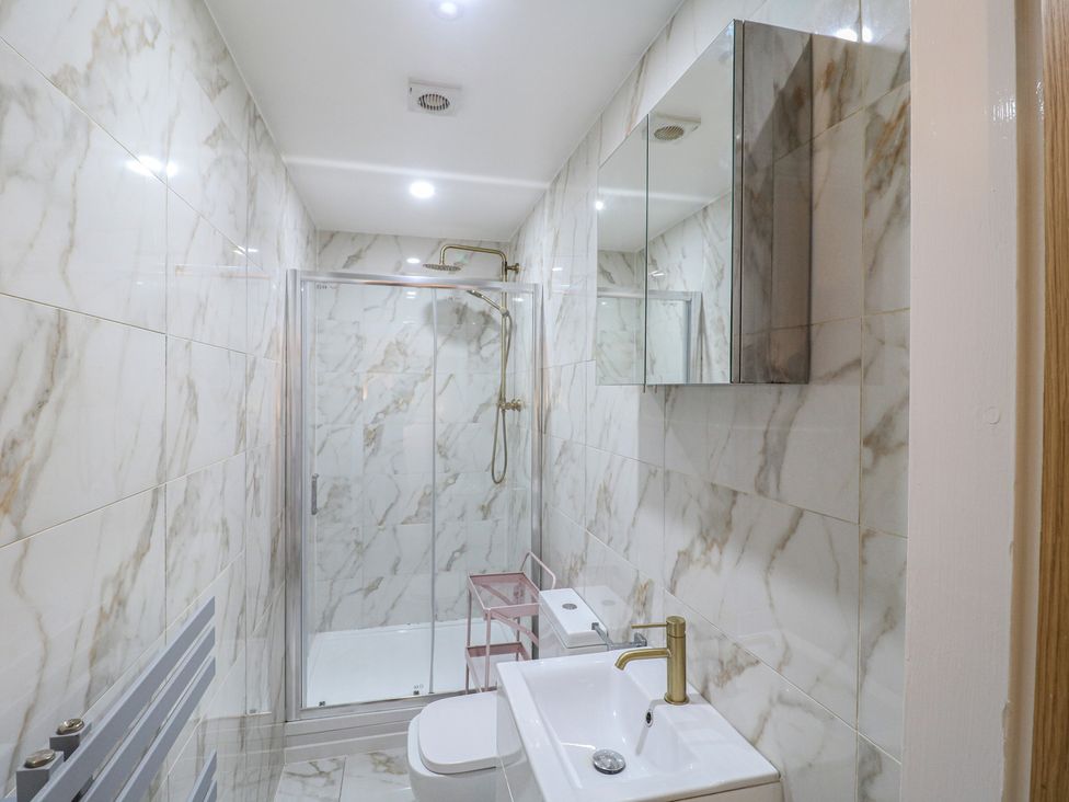 A bathroom with a shower, toilet, and sink at Unit 7 Apt 5 Sheffield