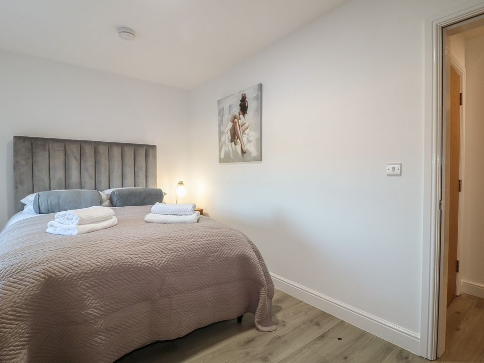 A bedroom with a bed and artwork at Unit 7 Apt 5 in Sheffield