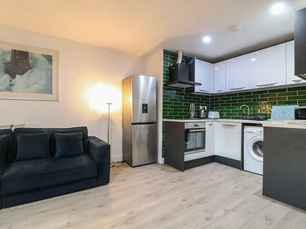A kitchen with sofa and appliances at Unit 7 Apt 6 (Delux) in Sheffield