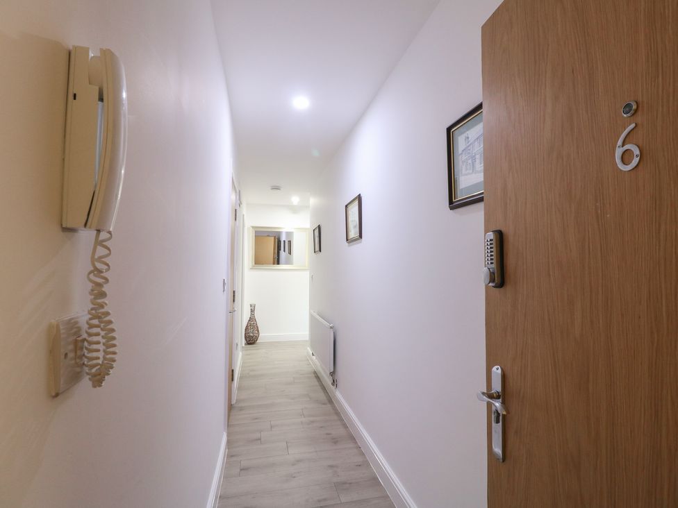 A hallway with intercom system and door number at Unit 7 Apt 6 (Delux) Sheffield