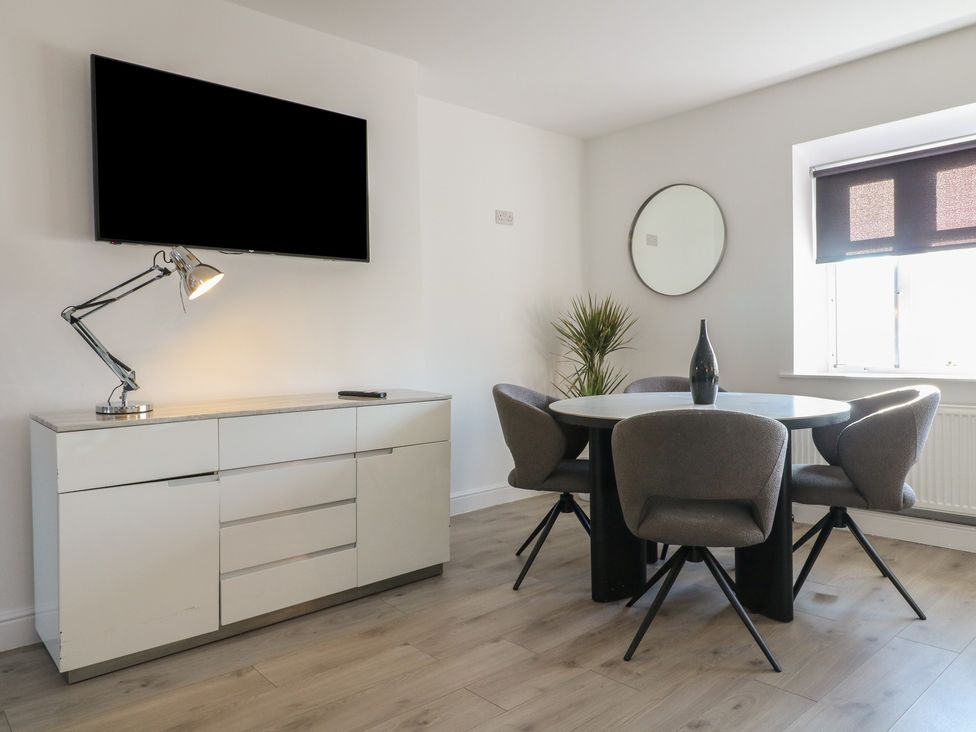 A dining room with a table and chairs at Unit 7 Apt 6 (Delux) Sheffield