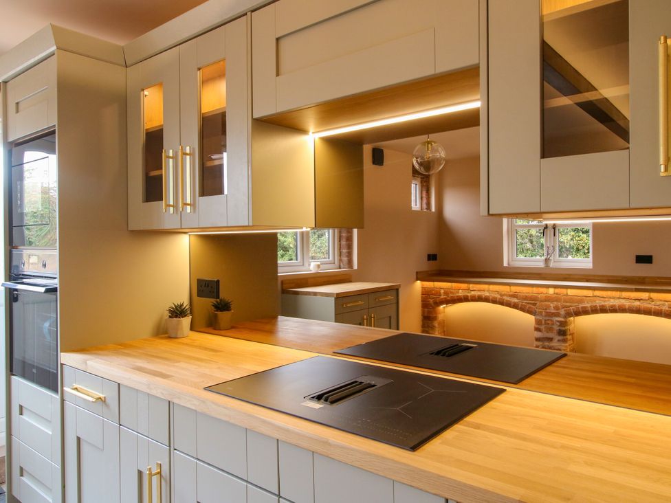 A kitchen with cabinets and countertop at The Barn at Tytchney near Ombersey and Droitwich Spa