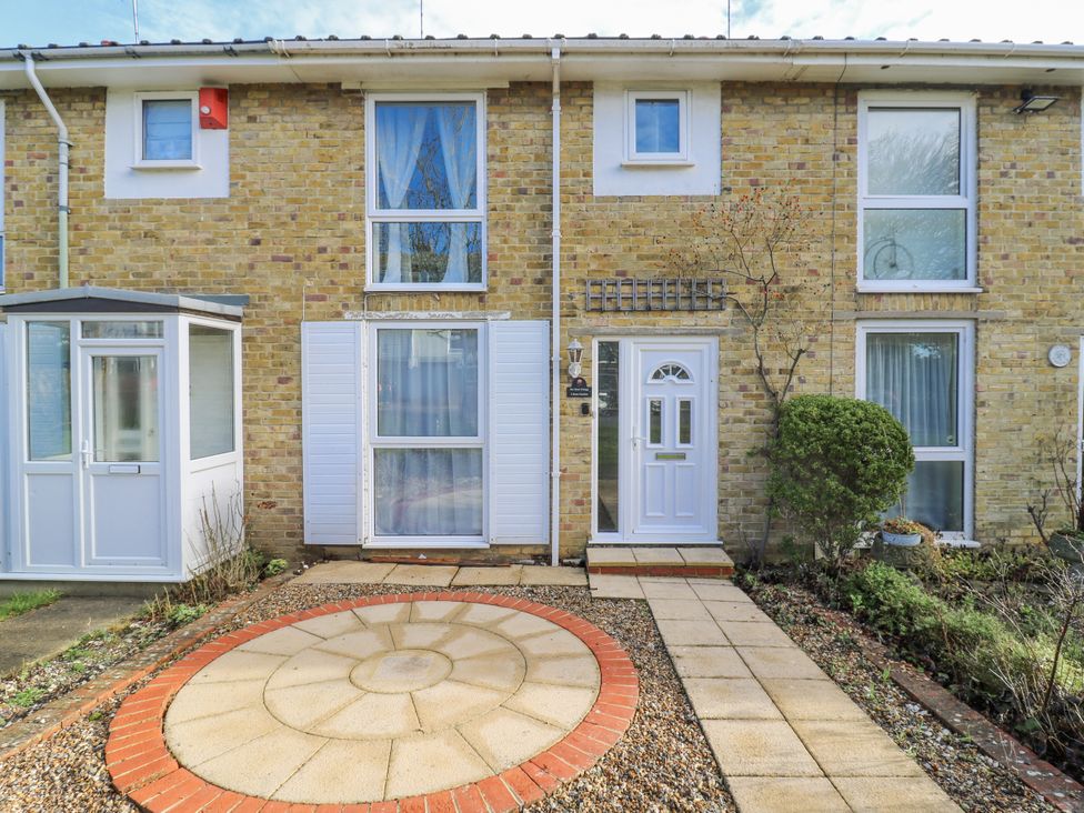 A building exterior with front door and windows at Sea Rose Cottage