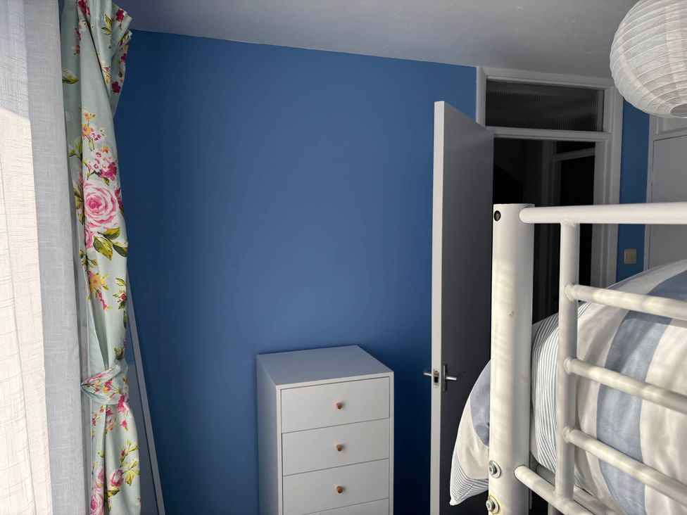 A bedroom with a drawer unit and a bunk bed at Sea Rose Broadstairs in Broadstairs