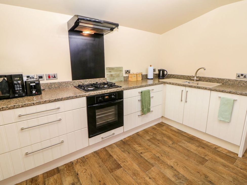 A kitchen with appliances and countertop at Millers Retreat in Chesterfield