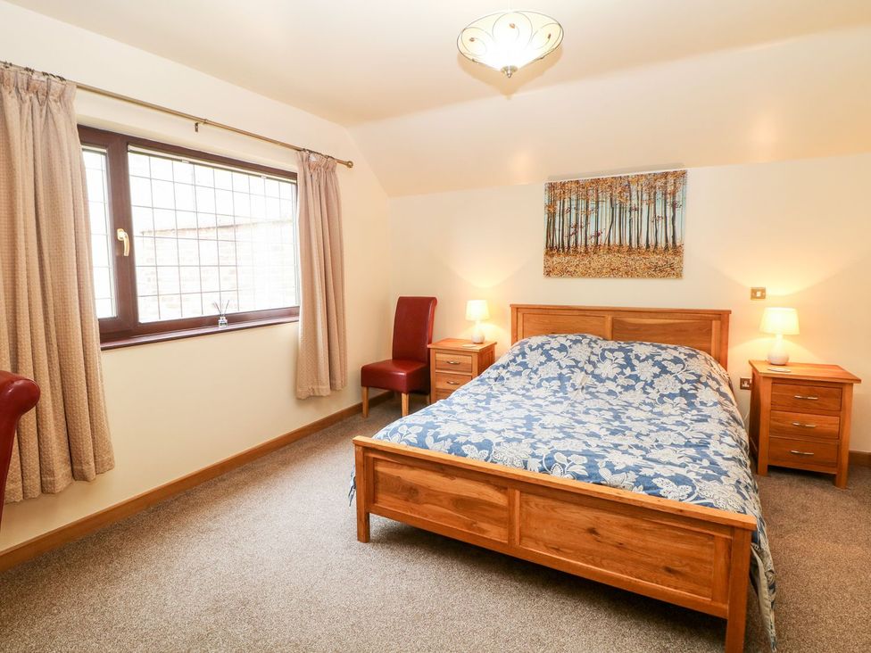 A bedroom with a bed and bedside tables at Millers Retreat in Chesterfield