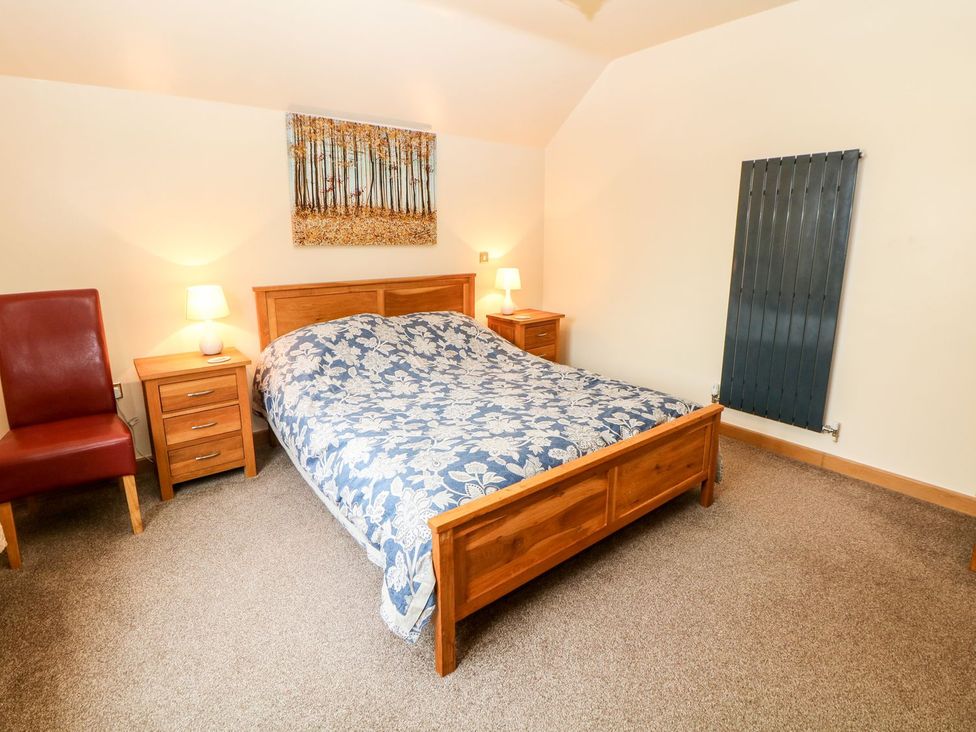 A bedroom with a bed and bedside table at Millers Retreat in Chesterfield
