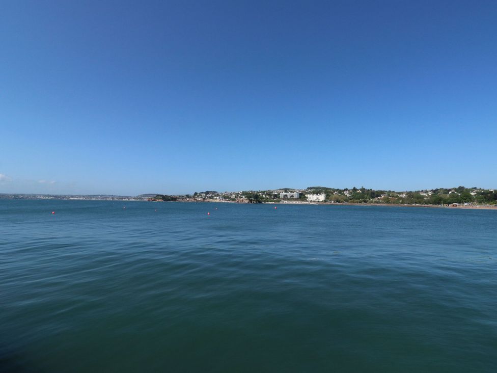 A view of the waterfront with buildings and blue sky at Flat 2 The Moorings in Torquay