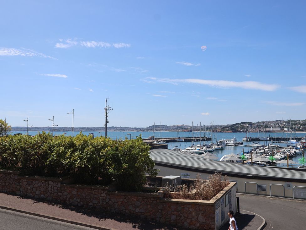 View of harbor with boats and plants near the road at Flat 2 The Moorings Torquay