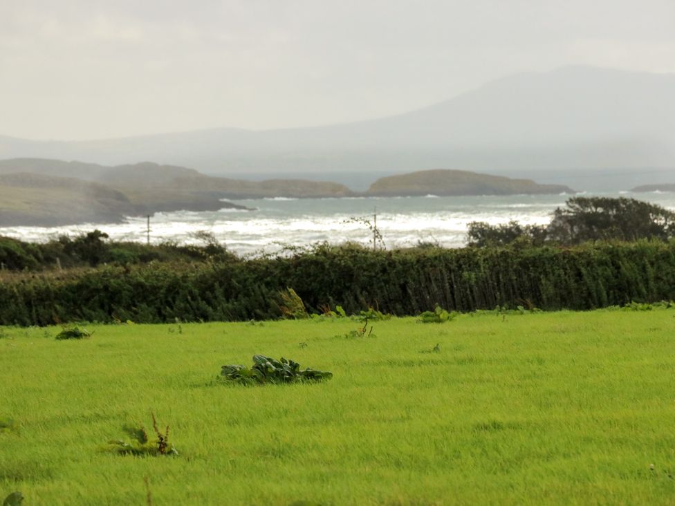 A landscape view of waves and greenery at Getws in Ty Croes