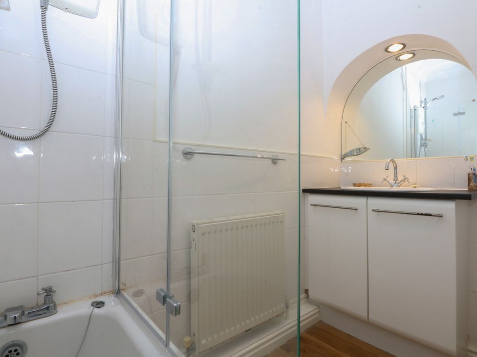 A bathroom with a shower and sink at 15 Rose Hill Beaumaris
