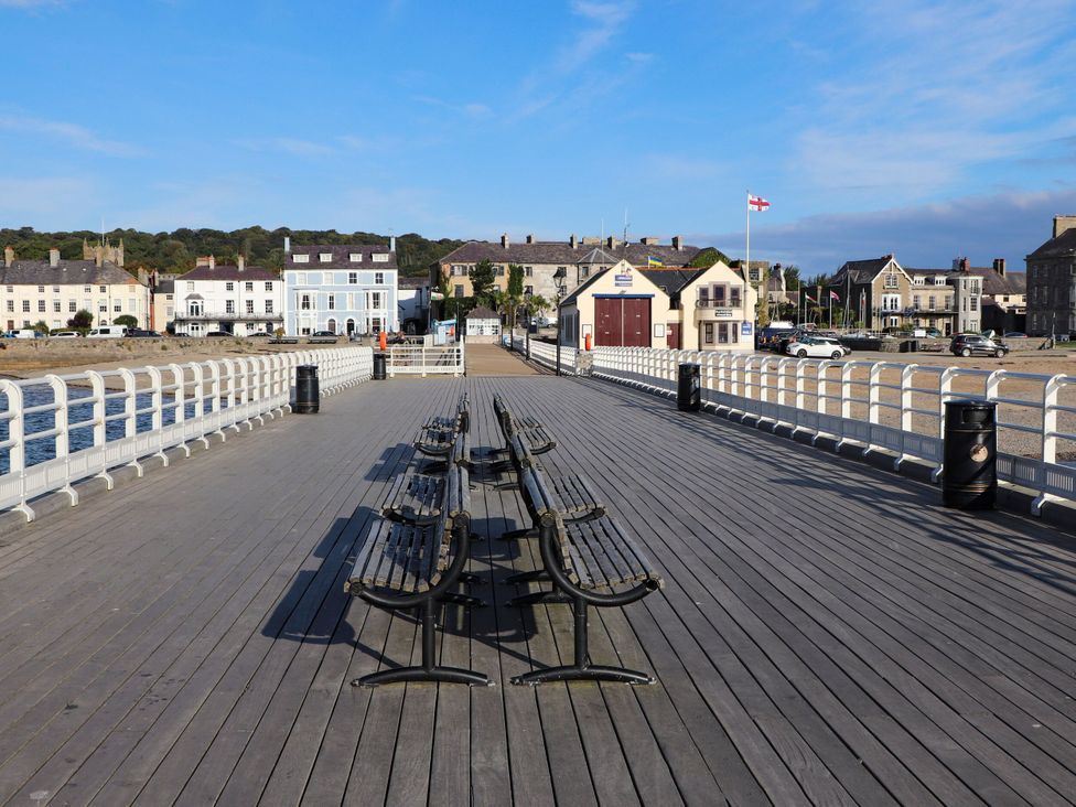 A pier with benches and a building at 15 Rose Hill Beaumaris
