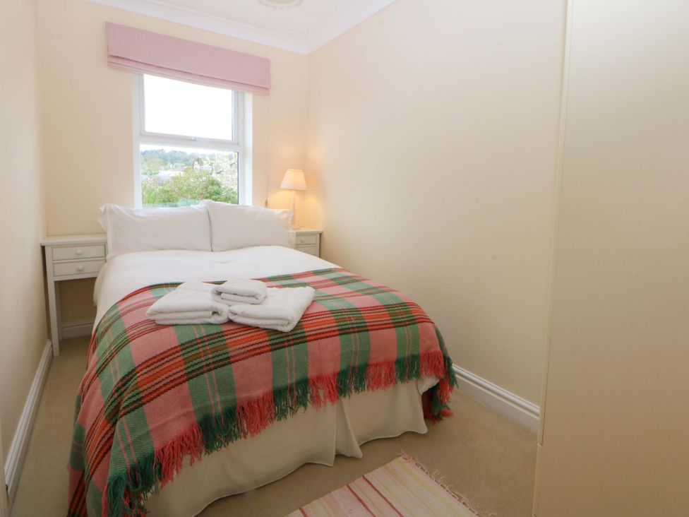 A bedroom with a single bed and side table at 15 Rose Hill Beaumaris