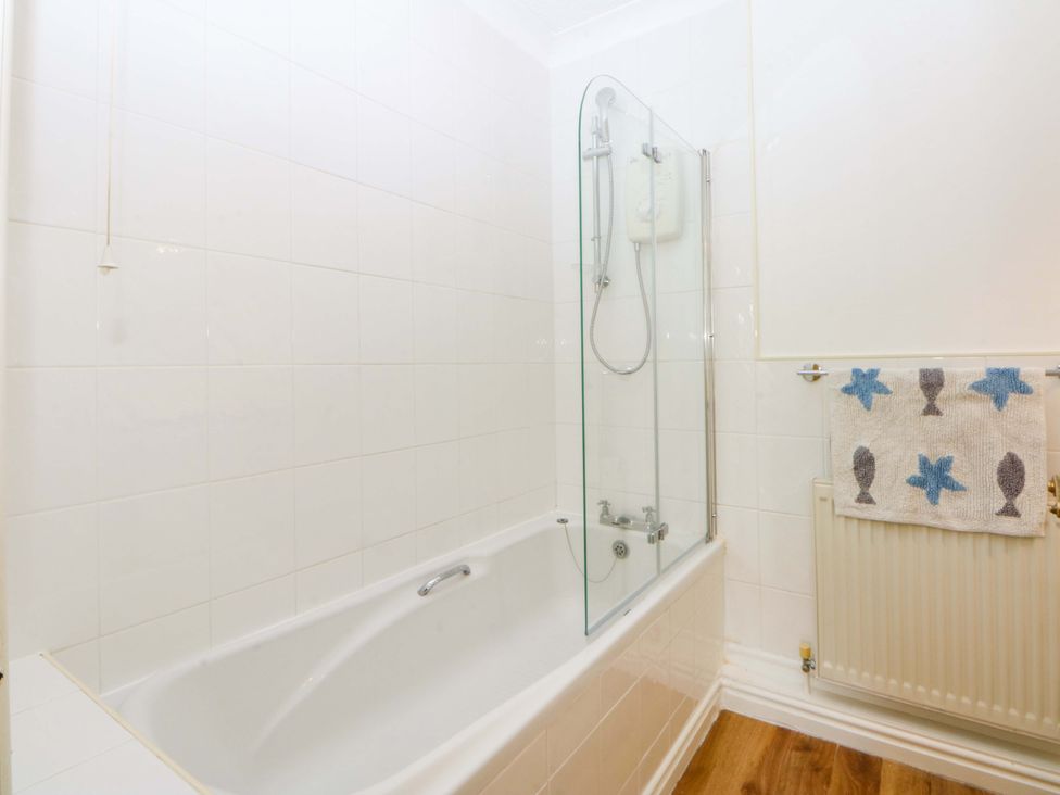 A bathroom with a bathtub and shower at 15 Rose Hill Beaumaris