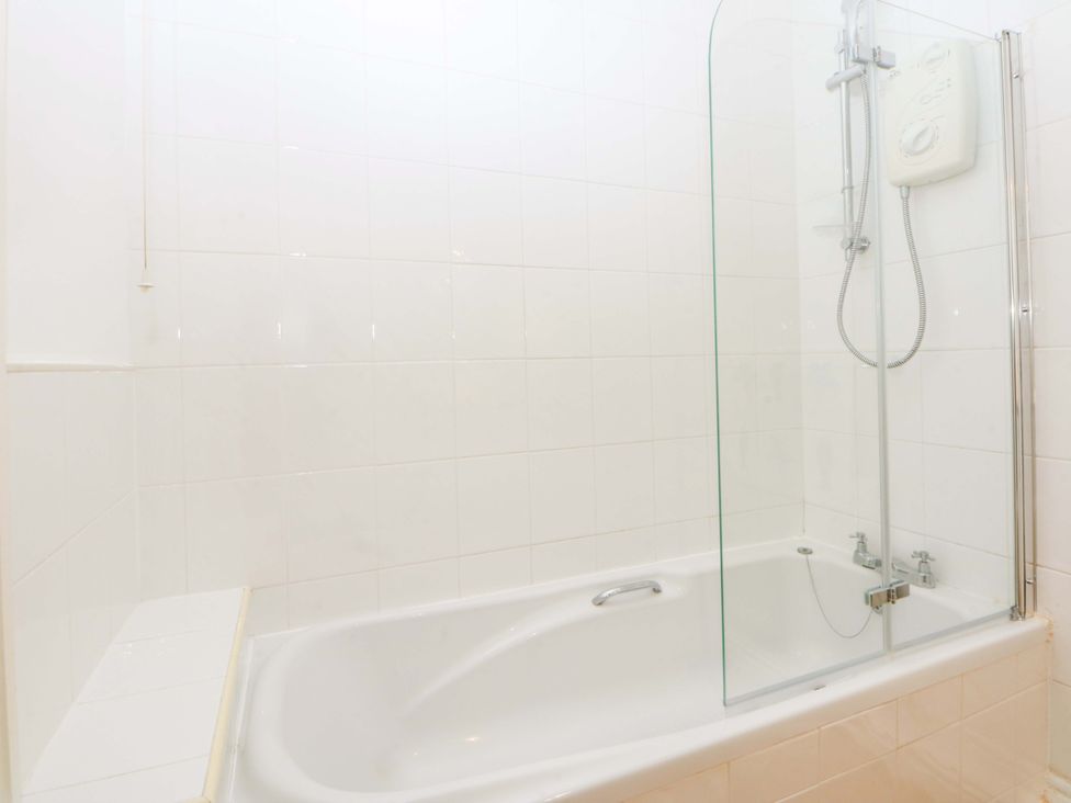 A bathroom with a bathtub and shower at 15 Rose Hill Beaumaris