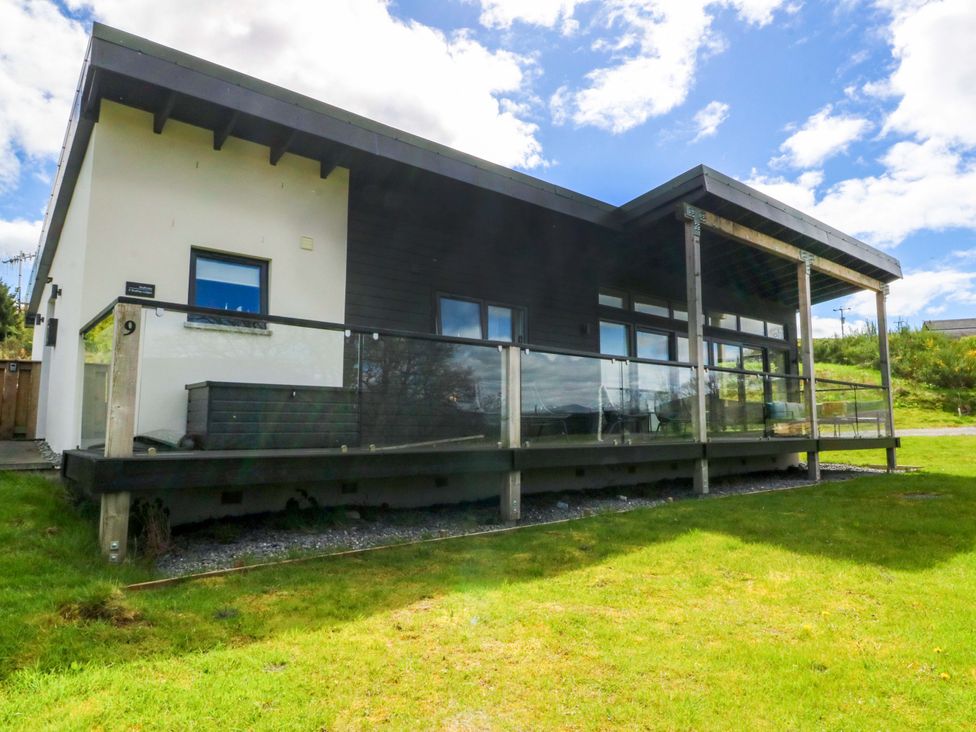 A house with a porch and glass railing at Strathview