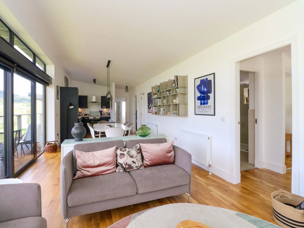 A living room with a sofa and table at Strathview