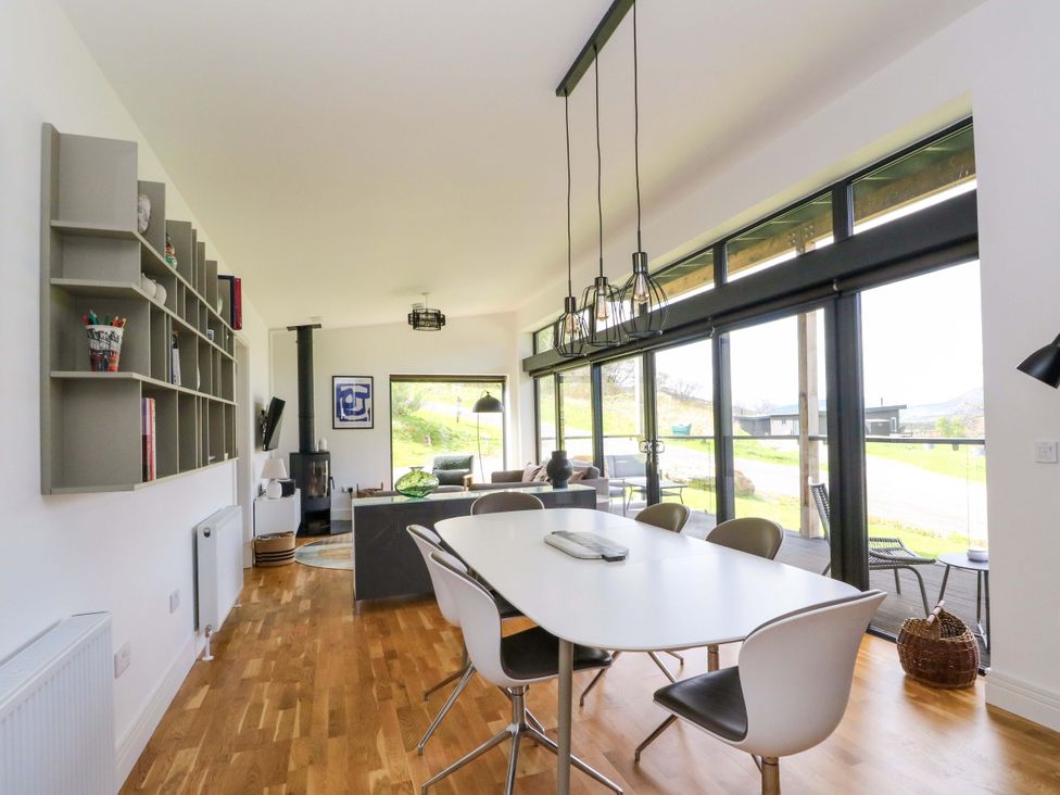 A dining room with table and chairs at Strathview