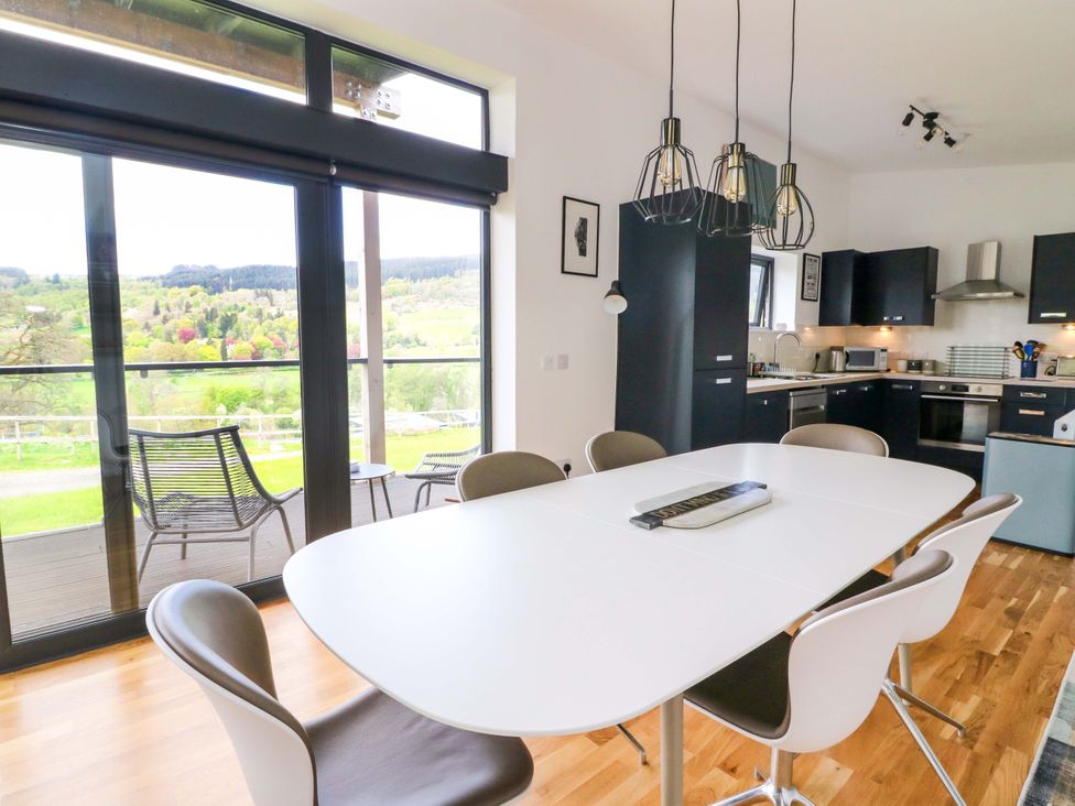 A dining room with a large table and chairs at Strathview