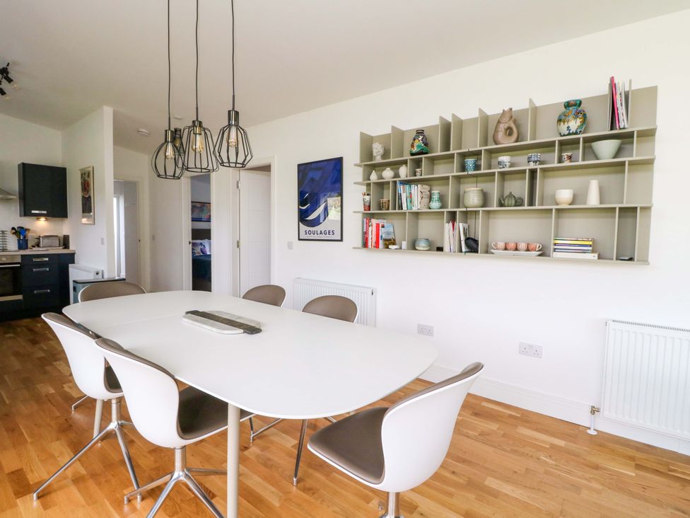 A dining room with a table and chairs at Strathview