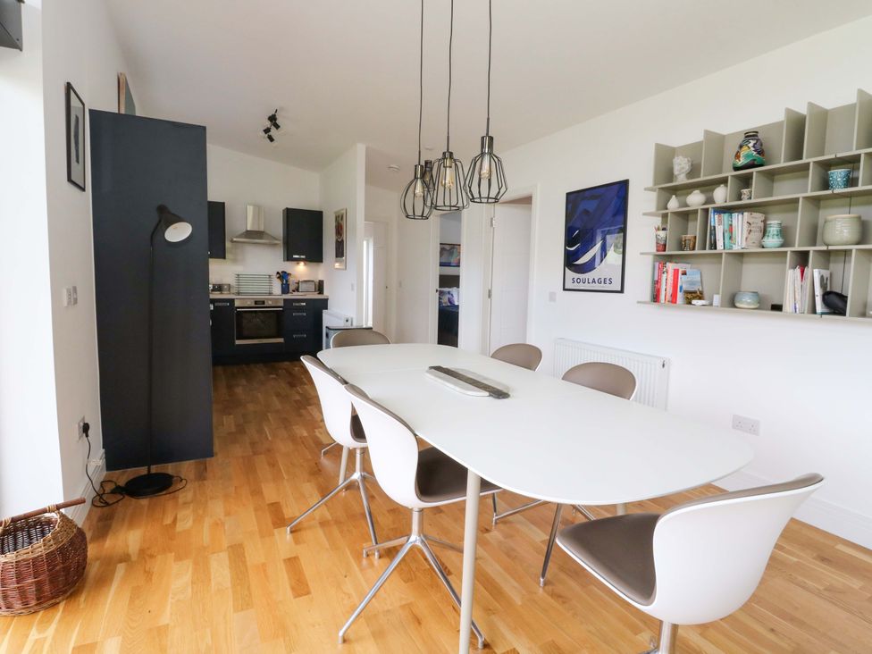 A dining room with a table and chairs at Strathview 