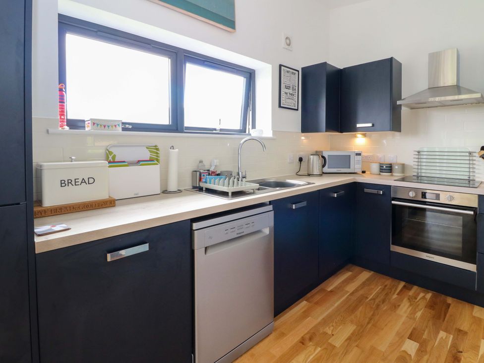 A kitchen with a sink and appliances at Strathview