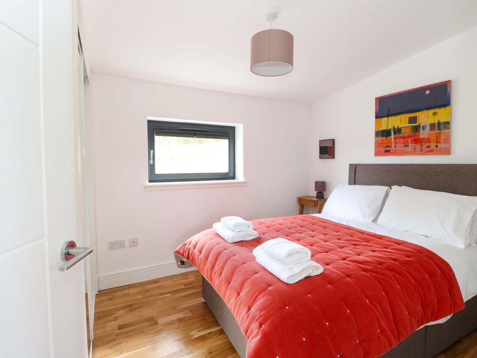A bedroom with a bed and window at Strathview