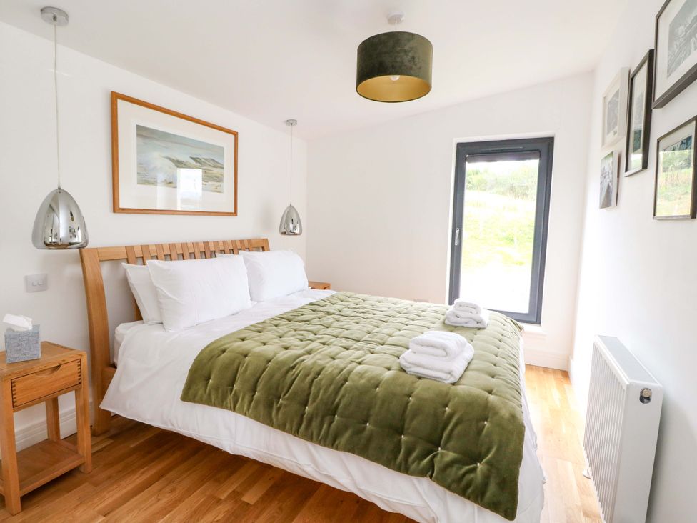 A bedroom with a bed and window at Strathview