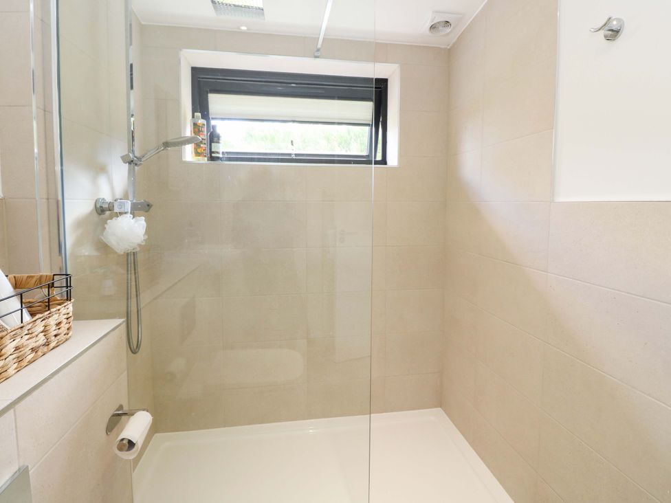 A bathroom with a shower and a window at Strathview