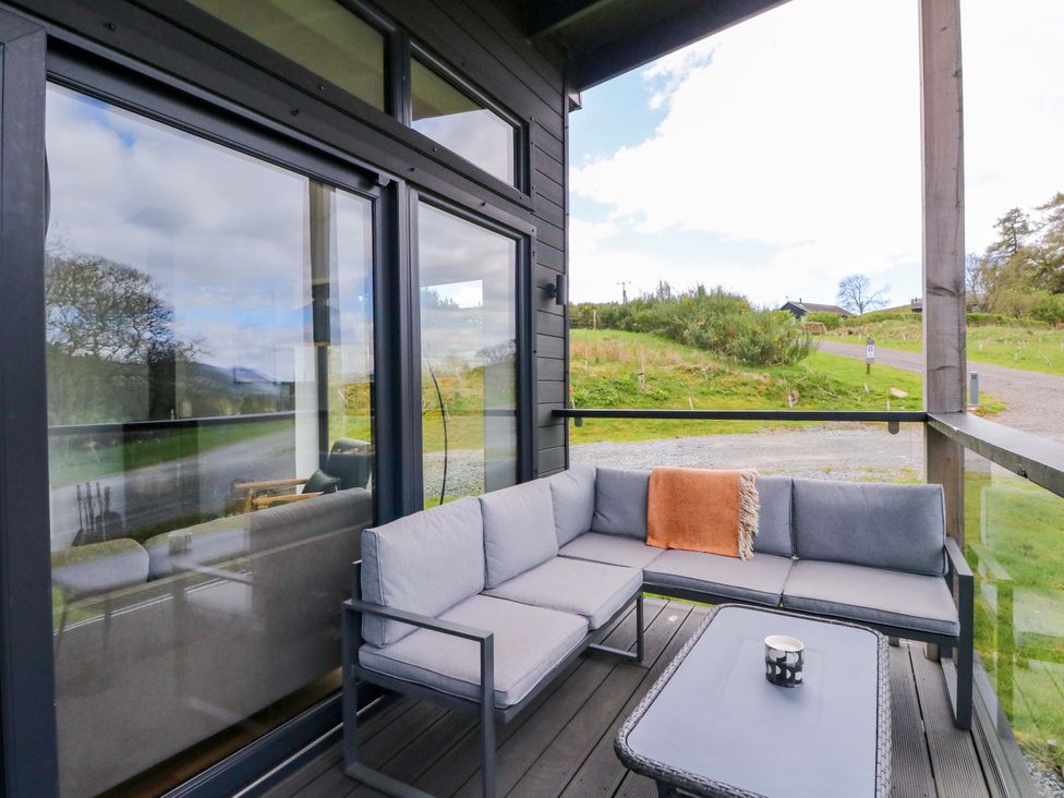 An outdoor patio with seating and a coffee table at Strathview 