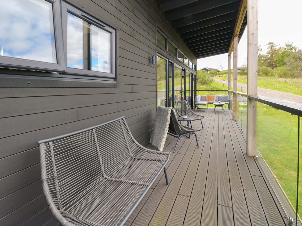 A deck area with seating and views at Strathview
