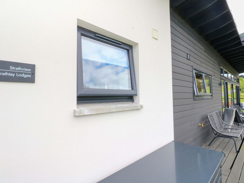 A window with a sign on the wall at Strathview in 